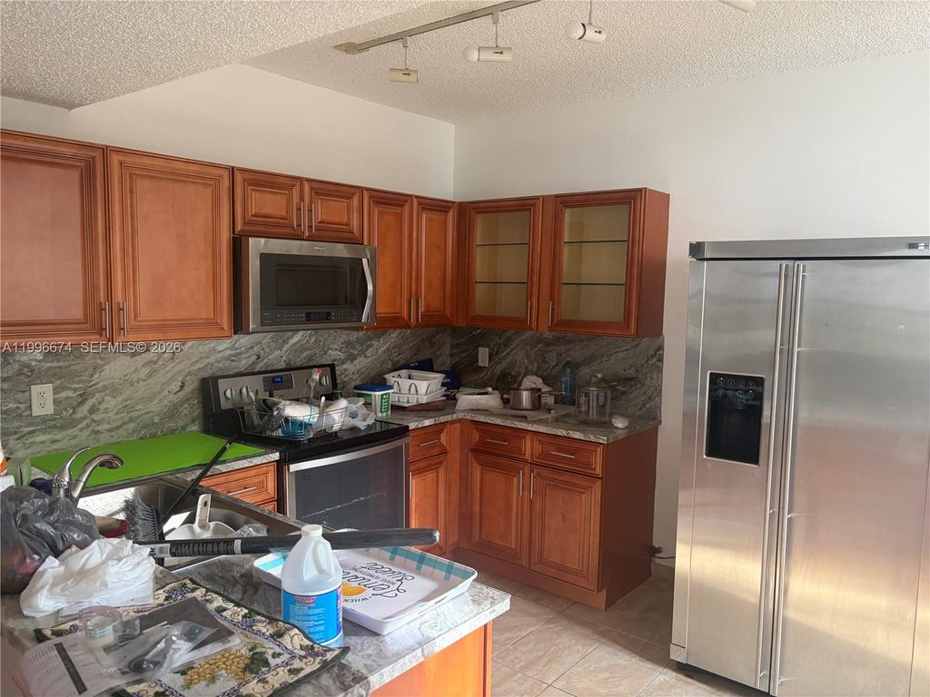 Photo of 11992 NW 11th St #11992, Pembroke Pines, FL 33026 (MLS # A11996674)