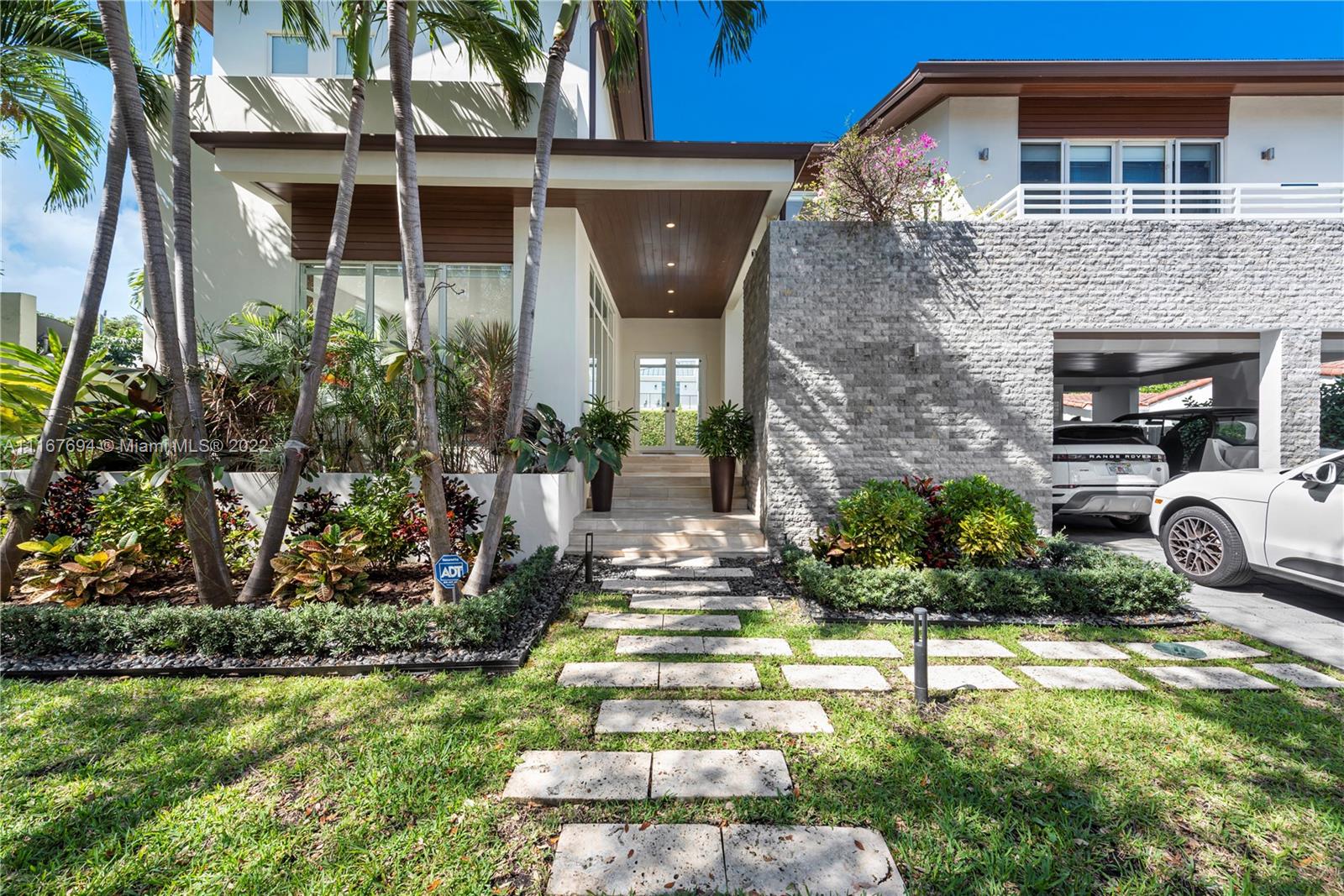 This gorgeous move-in ready ultra modern and sophisticated residence offers top of the line finishes, impact windows and doors, tons of natural light throughout making this beautiful residence bright and airy with very high ceilings, and spacious open areas. In addition, this home features an excellent floor plan with 6 generous size bedrooms, 6 full baths, great closet and storage areas, car port, 2 wonderful terraces, lovely backyard with lush landscaping for privacy, pool, and a phenomenal outdoor patio perfect for those who like to entertain. Located within a tropical island community, this stunning home sits on a 7,617 sq ft lot with 3,737 of living space under A/C. Enjoy this quiet tree lined street in the heart of the Village of Key Biscayne. Walk to parks, schools, beach and shops.
