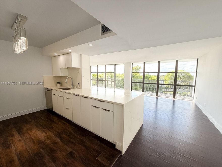 BEST DEAL IN THE BUILDING!! Welcome to this premium 1,455 Sq ft at Oceanview Park, offering 2 beds + Den ( convert to a 3rd bedroom) 2 bath CORNER UNIT with wrap around balcony overlooking the city! THE LARGEST UNIT IN COMPLEX with beautiful views from every room. Features Include: Floor to ceiling windows, Large Modern open concept Living room, Dining room & Renovated kitchen with Quartz countertops. Beautifully maintained full-service building with 24-hour doorman. Amenities Include: Heated pool, jacuzzi, tennis, sauna, gym, BBQ area with picnic tables, library & Club room. Prime Location in Three Islands and in the heart of it all and only a mile to the beach, Close to Luxury Restaurant's, Gulf Stream Park Casino & The Aventura Mall !!