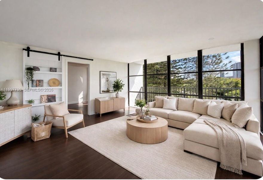 BEST DEAL IN THE BUILDING!! Welcome to this premium 1,455 Sq ft at Oceanview Park, offering 2 beds + Den ( convert to a 3rd bedroom) 2 bath CORNER UNIT with wrap around balcony overlooking the city! THE LARGEST UNIT IN COMPLEX with beautiful views from every room. Features Include: Floor to ceiling windows, Large Modern open concept Living room, Dining room & Renovated kitchen with Quartz countertops. Beautifully maintained full-service building with 24-hour doorman. Amenities Include: Heated pool, jacuzzi, tennis, sauna, gym, BBQ area with picnic tables, library & Club room. Prime Location in Three Islands and in the heart of it all and only a mile to the beach, Close to Luxury Restaurant's, Gulf Stream Park Casino & The Aventura Mall !!