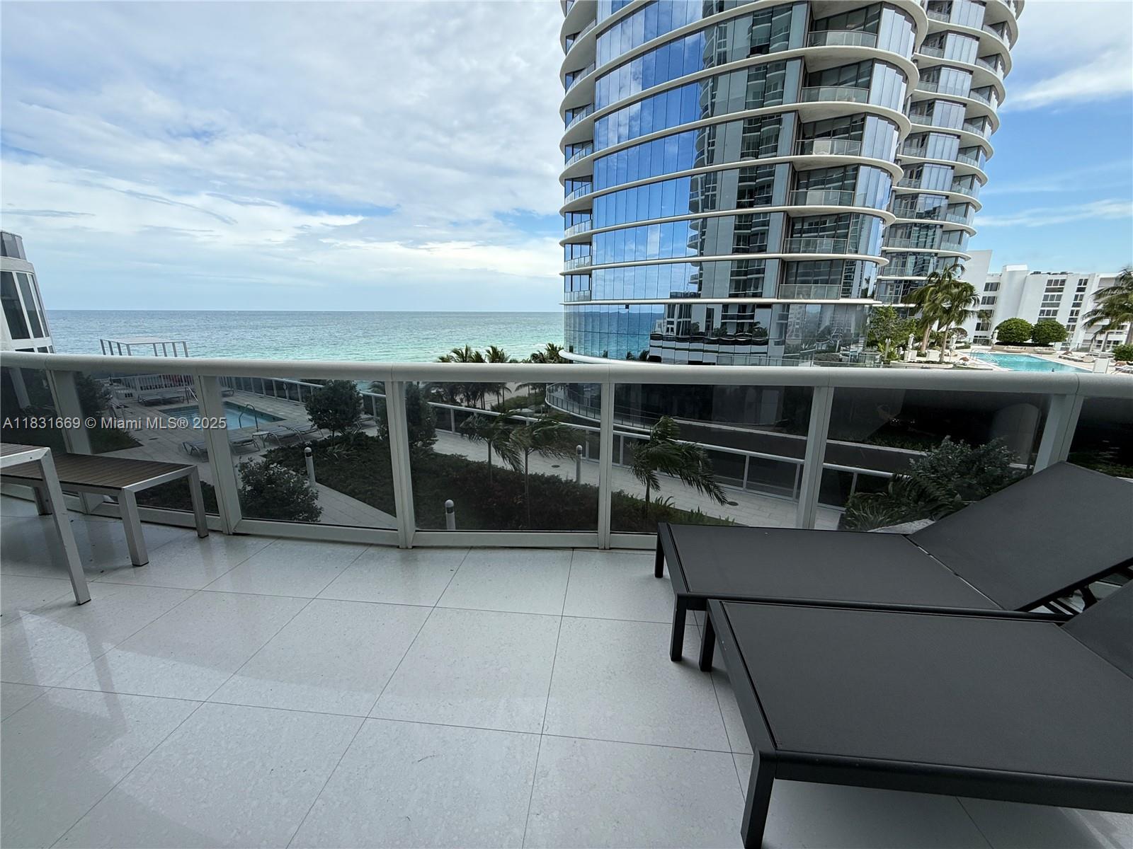 Spacious and beautifully furnished 2-bedroom + enclosed den / 3-bath residence with breathtaking ocean and city views. Featuring soaring 11-foot ceilings, an open-concept kitchen with granite countertops and stainless steel appliances, and a smart, comfortable layout — this unit is move-in ready.
Enjoy resort-style living with premium amenities, including a gym, sauna, heated pool, clubroom, business center, kids room, and full beach service with towels and chairs.
Perfectly located within walking distance to restaurants and shops, and just minutes from Bal Harbour, Aventura Mall, and major airports.