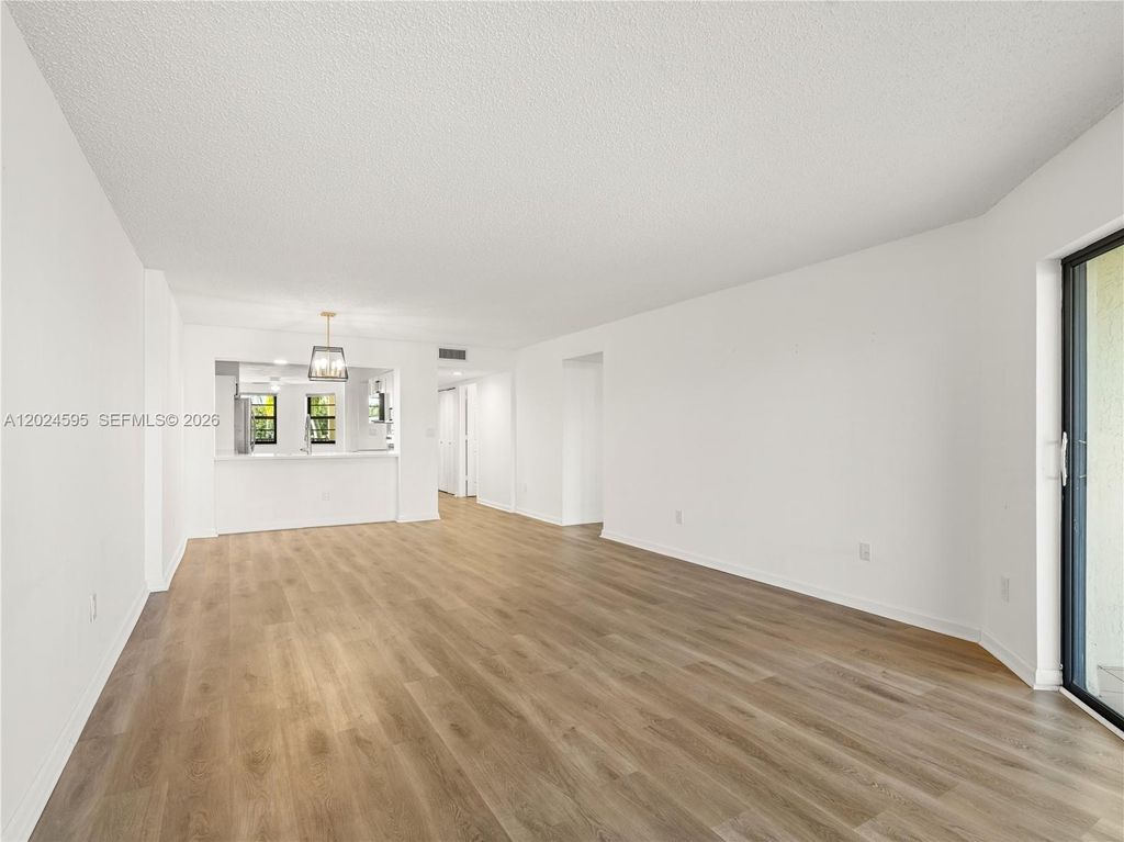 Photo of 7547 Fairfax Dr #210, Tamarac, FL 33321 (MLS # A12024595)