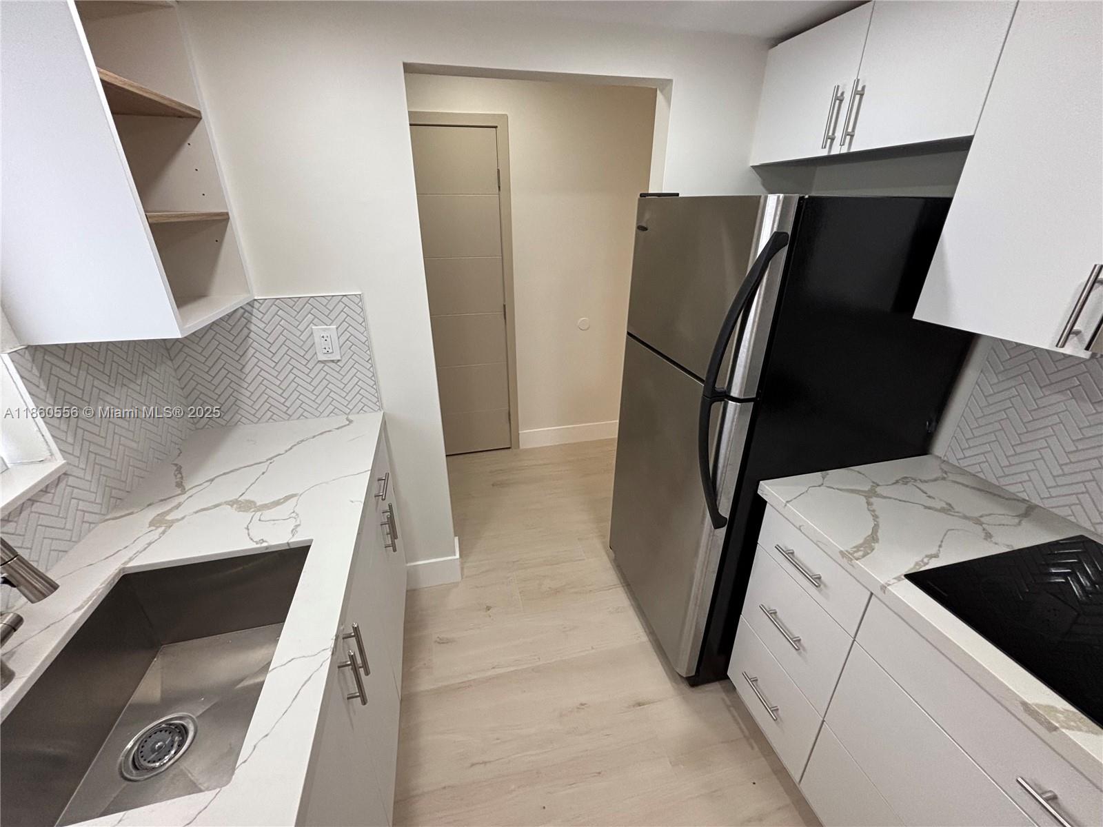 Location! Location! Lovely 2-story condo with 1 bedroom/1.5 bathrooms blessed by daily natural light. Gated security, quiet environment where every family member can enjoy their amenities and appreciate this relaxing oasis. Offers a nice view of the garden & pool from both 1st and 2nd floor windows and balcony. The second floor features the primary bedroom with an en-suite bathroom & spacious double closet. Additional highlights include convenient under-staircase storage, a guest bathroom on the main floor, and an assigned parking space.