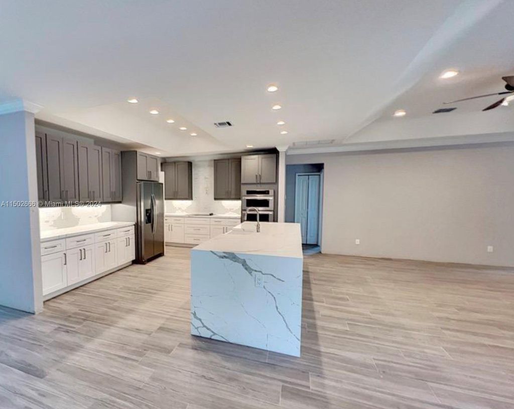 Photo of 4610 SW Quezon St, Port Saint Lucie, FL 34953 (MLS # A11502666)