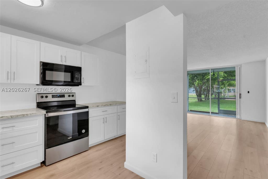 Photo of 9601 Sunrise Lakes Blvd #106, Sunrise, FL 33322 (MLS # A12026267)