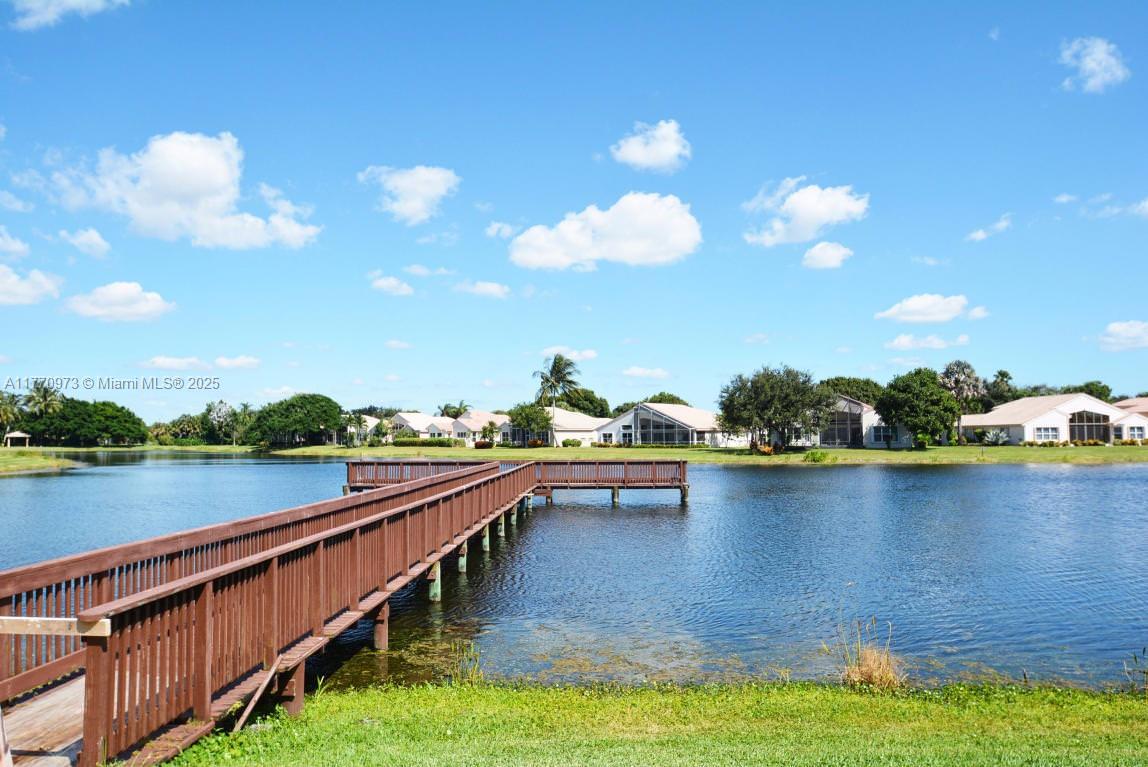 HOME GENERATOR, SPACIOUS ROOMS, NEW ROOF, HURRICANE SHUTTERS, HOME WARRANTY. Valencia Lakes is a vibrant, active adult community located in Boynton Beach, Florida. Nestled in the heart of Palm Beach County, Valencia Lakes offers residents a resort-style living experience with a focus on relaxation, recreation, and an engaging lifestyle. The Community was totally remodeled in 2025, features a wide array of amenities, including a clubhouse, fitness center, swimming pool, tennis courts, and a variety of social and recreational clubs and activities.Conveniently located, Valencia Lakes is close to shopping, dining, and entertainment options. Valencia Lakes is an ideal choice for those seeking a fulfilling and active lifestyle in sunny Florida.