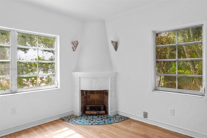 Perched on the top floor of a gated building at the iconic intersection of Española Way and Meridian, this sun-drenched corner studio is a rare find. High ceilings and abundant natural light fill the 580 sqft space, showcasing original Art Deco character at every turn from the decorative fireplace and signature arched entryways to the resurfaced hardwood floors. Generous closets, washer/dryer hookups, and a versatile floor plan with ample room to carve out a sleeping nook or separate bedroom make this a move-in ready canvas  configure it your way. Steps from Flamingo Park, two blocks to Lincoln Road, and moments from world-class dining, shopping, and beach the location alone is unmatched.