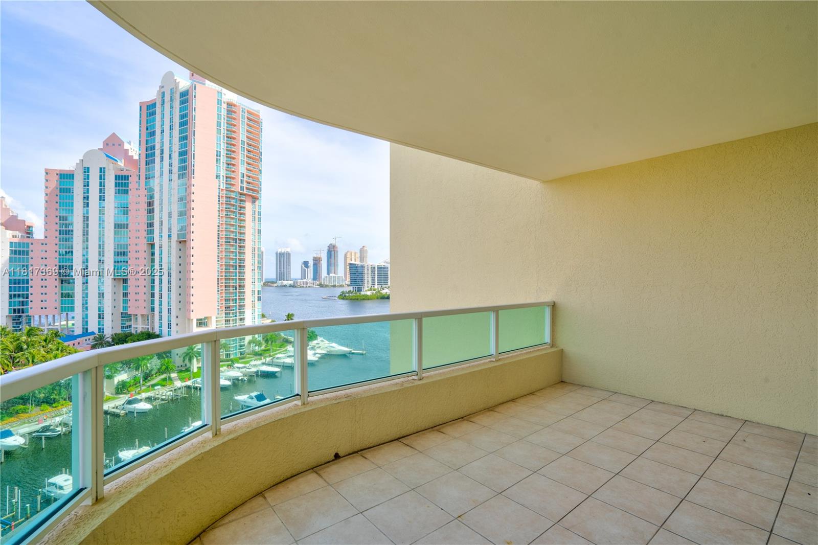 This stunning and spacious waterfront condo features 2 bedrooms plus a den, offering breathtaking views of the ocean, Intracoastal Waterway, city skyline, marina, and golf course. The open floor plan includes an eat-in kitchen equipped with Italian cabinetry, stainless steel appliances, and granite countertops. Pergo flooring stretches throughout the space. Enjoy resort-style amenities such as a pool, fitness center, and a man-made sandy beach. Additional benefits include 24-hour security, covered parking, and valet service. The condo is conveniently located next to Founders Park and is close to restaurants, places of worship, Aventura Mall, shops, and a convenience store.