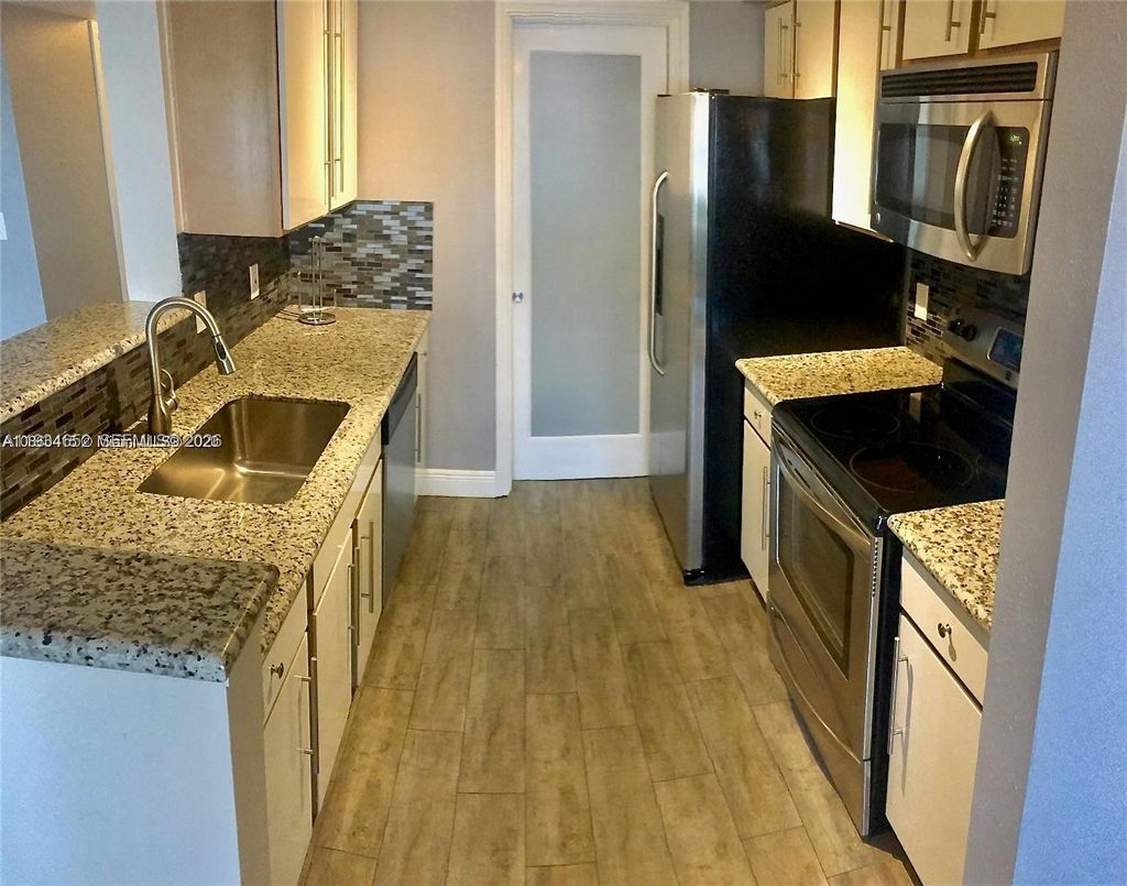 Photo of 2445 NW 33rd St #1404, Oakland Park, FL 33309 (MLS # A11934652)