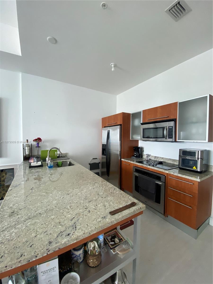 Stunning penthouse 1/1.5 bath with enormous den that can be used as another bedroom. Only a handful of these units in the building. This is an opportunity not to be missed. The unit is spacious and has an amazing view. The location is stellar! Walking distance from everything. Cable, internet, water and valet parking for one car is included in the monthly rent. Show by appt only and tenant occ till Oct 31. The pool is under construction and the competition date has not been given yet. Applciations are approved usually in less than 10 days.