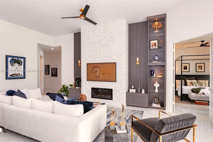 Discover a rare opportunity in the highly desirable Riverwalk of West Palm Beach! This upgraded Extended Oakmont Model offers an open space concept, 3 bedrooms, 2 baths, and a versatile den/flex space, all with stunning lake views. Features include porcelain tile flooring, high ceilings, a custom entertainment wall with fireplace, and a chef’s kitchen with extended peninsula, stainless steel appliances, and Arhaus lighting. Enjoy a spa-like primary bath with freestanding tub and dual vanity, modern guest bath, and chic custom bar. The beautifully landscaped patio with pergola, and lounge areas is perfect for relaxing or entertaining. A 2-car garage plus space for 2 more adds convenience plus a electric charge. This is more than a home—it’s a lifestyle. Schedule your private showing today!