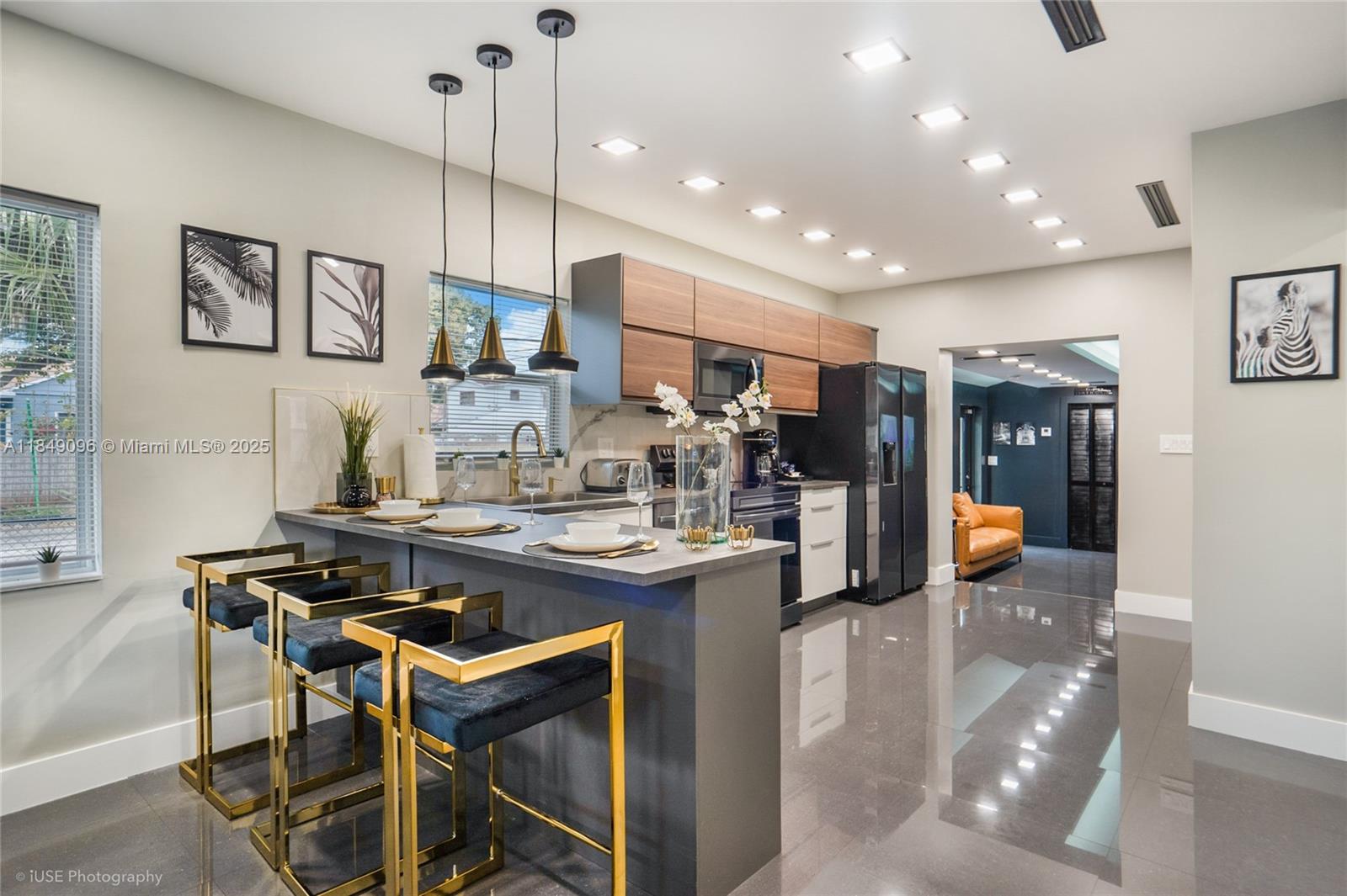 Experience the vibrancy of Miami! You will feel perfectly at home in this brand-new 5-bedroom, 4-bath (3 en-suite!) + laundry Villa. Boasts a vibrant backyard & a beautifully designed interior. It even has Classic Arcade Games. Just 10 minutes away from the Beach, the Airport, the Port & the FTX Arena. Close to the murals of Wynwood & Brickell, which boast great restaurants, shopping, and nightlife. Unlimited street parking is included only. No gated parking. ******FURNISHED ONLY ***** NO CALLS OR SHOWINGS ON SATURDAYS*****