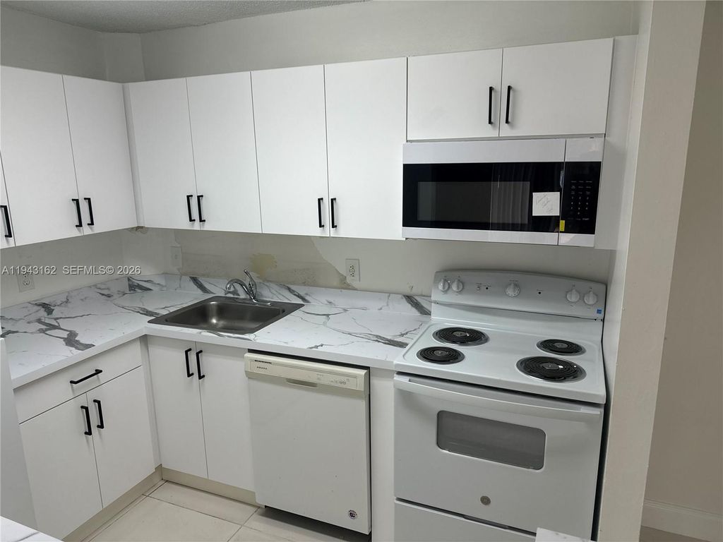 Photo of 10773 Cleary Blvd #104, Plantation, FL 33324 (MLS # A11943162)