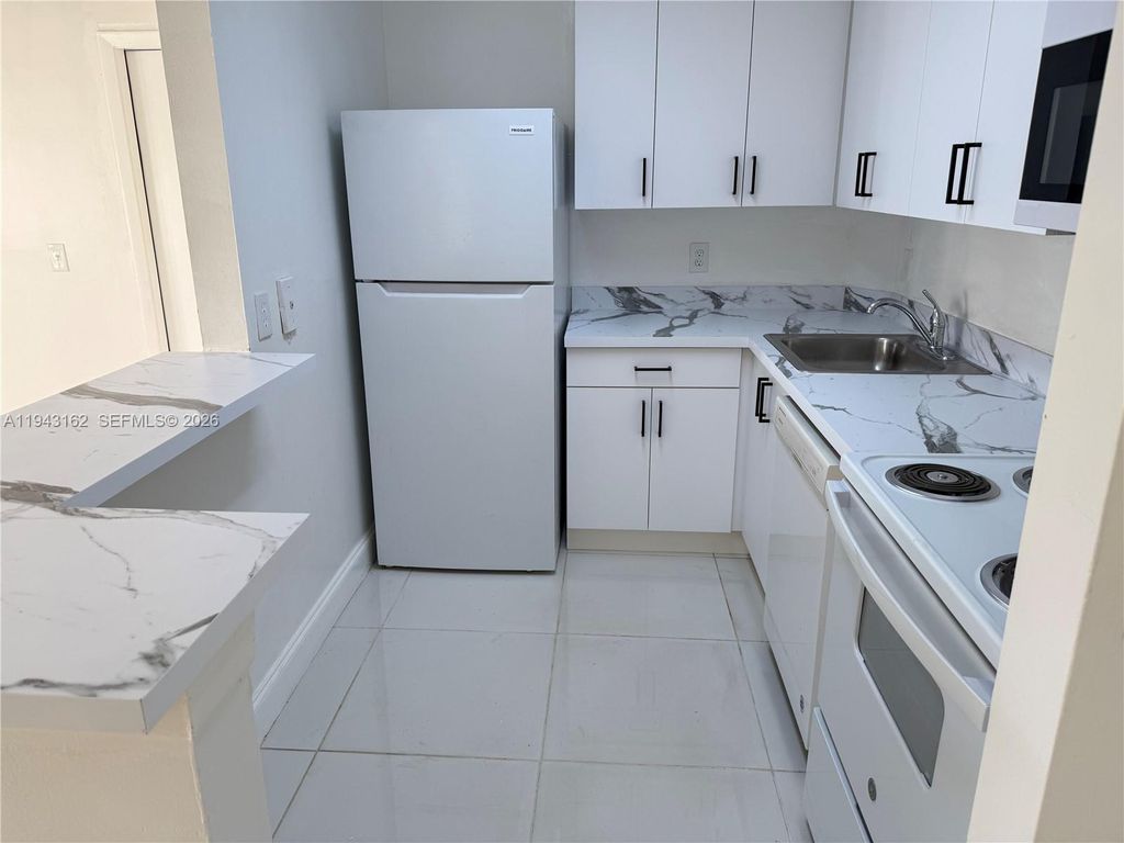 Photo of 10773 Cleary Blvd #104, Plantation, FL 33324 (MLS # A11943162)