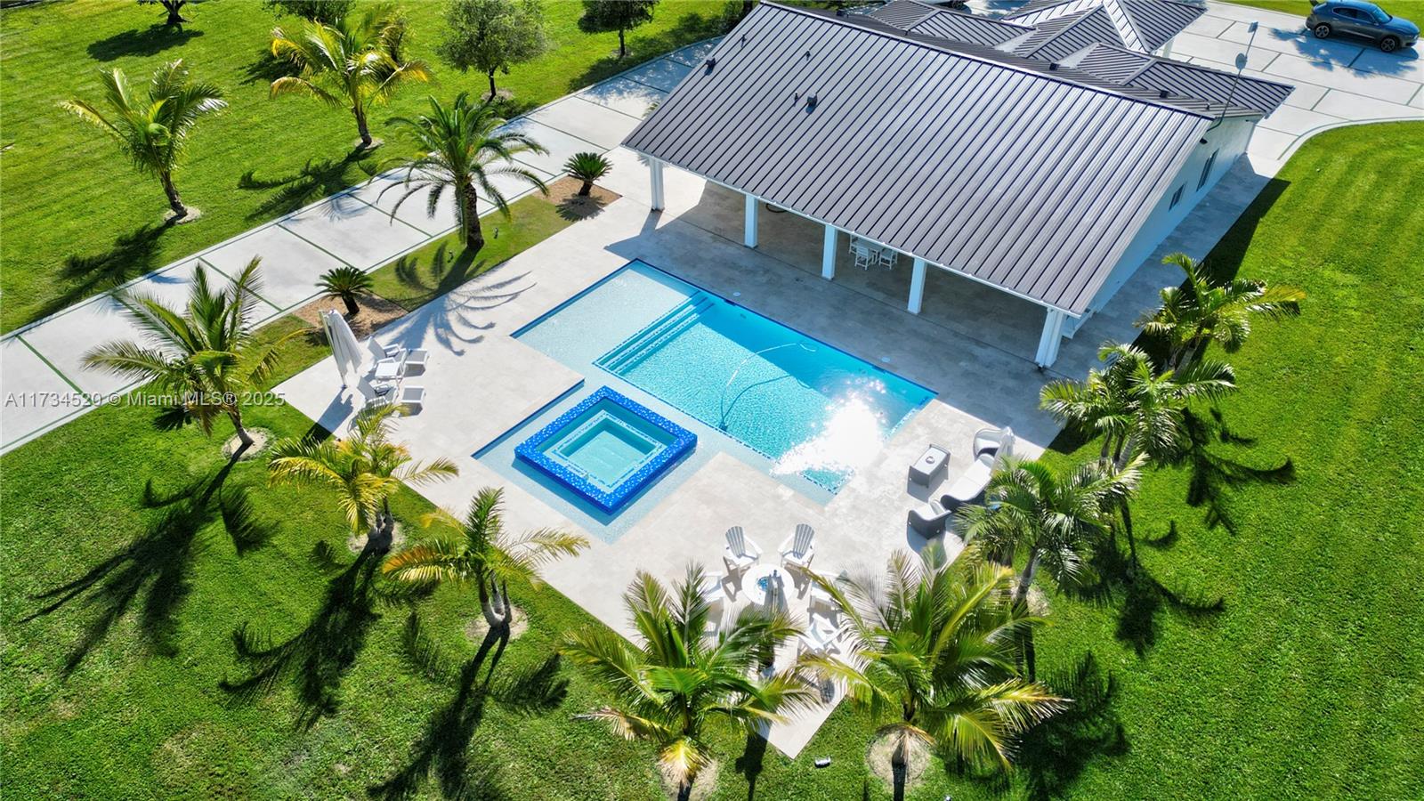 Welcome to Paradise!! This 4.79 lot (208,652 sq/ft) consists of a main house, guest house, 40x30 salt water pool with whirlpool, surrounded by fruit trees, palm trees and an unbelievable outdoor entertainment area for all of your friends and family. The entire property was renovated inside and out with a blend of luxury and countryside living. Property features 5 Bedrooms and 4 bathrooms that includes a separate 1 bedroom and 1 bathroom guest house. Entire property has hurricane impact windows. A must see dream property!!