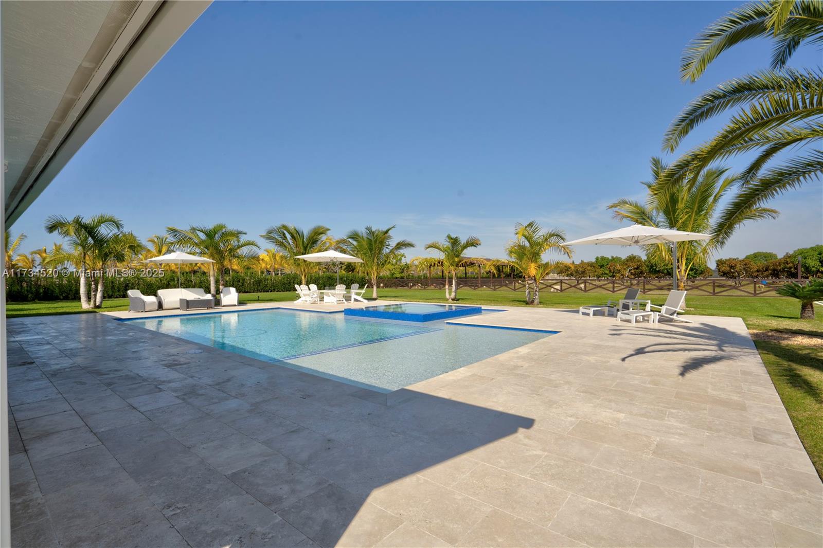 Welcome to Paradise!! This 4.79 lot (208,652 sq/ft) consists of a main house, guest house, 40x30 salt water pool with whirlpool, surrounded by fruit trees, palm trees and an unbelievable outdoor entertainment area for all of your friends and family. The entire property was renovated inside and out with a blend of luxury and countryside living. Property features 5 Bedrooms and 4 bathrooms that includes a separate 1 bedroom and 1 bathroom guest house. Entire property has hurricane impact windows. A must see dream property!!
