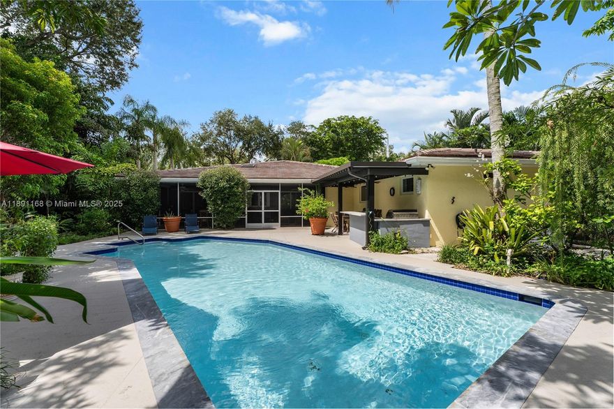 Set in one of the most desirable locations on a 17,700 sq. ft. lot, this home is surrounded by lush tropical landscaping, creating a private sanctuary moments from top schools and city conveniences. The single-story residence features a thoughtful 4/3 layout designed for comfort and ease of living with wonderful formal & informal living areas, a spacious separate guest suite & a large primary suite. Outdoor spaces inspire refined entertaining with a peaceful screened Fla room, a covered terrace with BBQ-bar & a sparkling pool framed by mature foliage. A 2-c garage offers abundant storage. Whether hosting under the stars, enjoying a quiet evening or relaxing poolside, this retreat delivers both vibrancy and tranquility, inviting you to enhance, expand, or simply enjoy its timeless appeal.