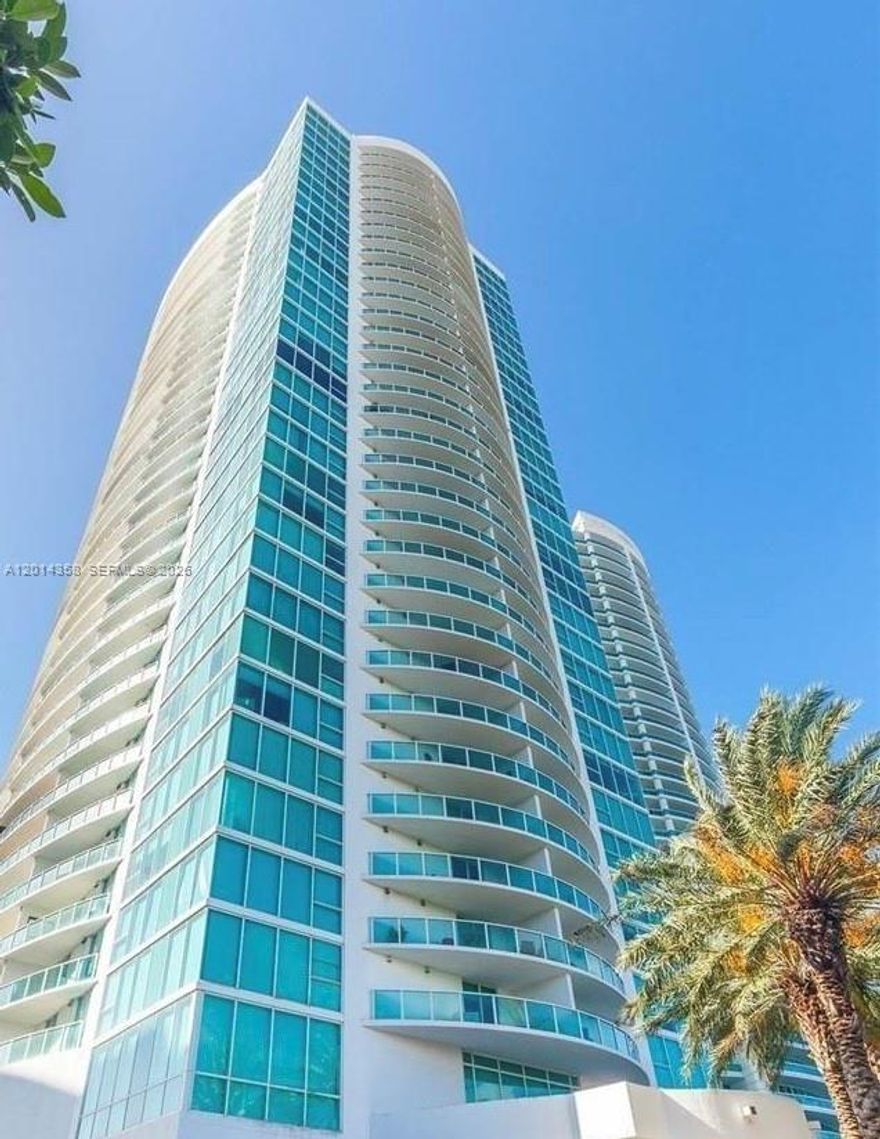 Bright and beautiful 1 bedroom, 1 bath unit with ocean and skyline views.  Open layout, wood floors (laminate), kitchen with stainless steel appliances and new washer and dryer in unit.  Large walk in closets and spacious balcony for relaxing or entertaining.  Resort-style amenities, including concierge, Cafe-Convenience Store, 24 hour valet parking, state of the art fitness center with direct ocean views, heated pool, sauna and sap, private marina, tennis court, child playground, party room and more.