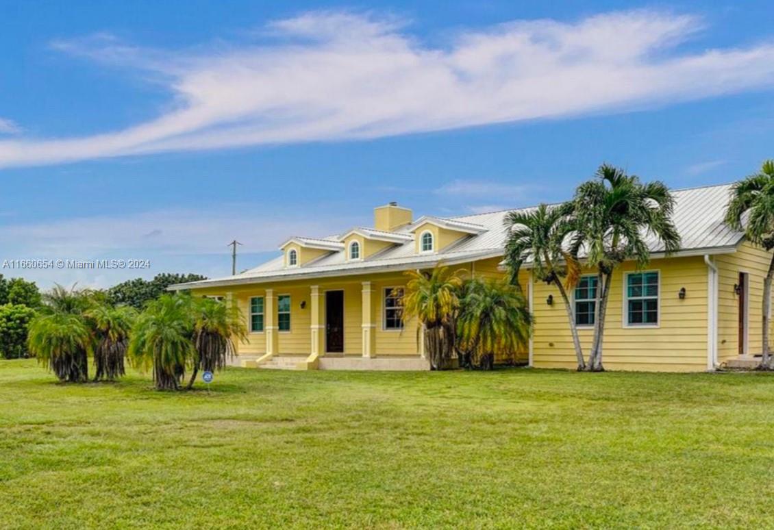 This charming rustic chic home located in the heart of homestead is the perfect place to call home. With 26 impact blue windows you'll enjoy plenty of natural light showcasing stunning views of the surrounding greenery. This beautiful home boasts not one, but two master bedrooms - perfect for multi-generational living! You'll never have to worry about maintaining your lush landscaping thanks to the built-in irrigation system.Located just 20 minutes from the renowned Florida Keys, this property offers a prime location for outdoor enthusiasts. Plus, with an agricultural exemption and no water bill, you can embrace a sustainable and cost-effective lifestyle. Don't miss out on this unique opportunity to own a truly special property at the heart of Homestead.