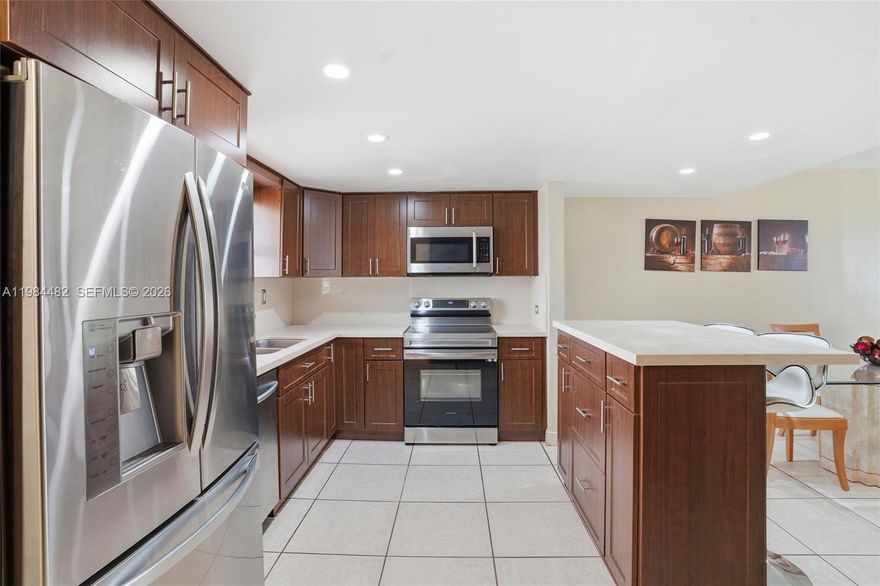 Looking for a 2-bed condo in Miami under $350K with space, upgrades, and location? This 2-story unit in Park East Condominiums offers 1,196 sq ft, a renovated kitchen with stainless steel appliances, private balcony, and in-unit laundry, all minutes from Miami International Airport, Florida International University, and Dolphin Mall.

Welcome to this well-maintained 2-bedroom, 2-bath condo offering a spacious two-story layout designed for comfortable living. The main level features an open and generous living area that flows seamlessly to a private balcony, perfect for relaxing or entertaining. The upgraded kitchen is equipped with stainless steel appliances and modern finishes, complemented by tile flooring throughout the entire unit for easy maintenance and a clean aesthetic.

Upstairs, enjoy added privacy with both bedrooms along with a convenient in-unit washer and dryer. The home also includes multiple storage closets and the rare benefit of three parking spaces. Located within the gated Park East Condominiums community, residents enjoy 24-hour security along with resort-style amenities including two pools, tennis courts, a clubhouse, and sauna.

Built in 1972 with a low monthly HOA of $309, this centrally located property offers quick access to major highways, shopping, dining, and key Miami destinations. Offered at $325,000.