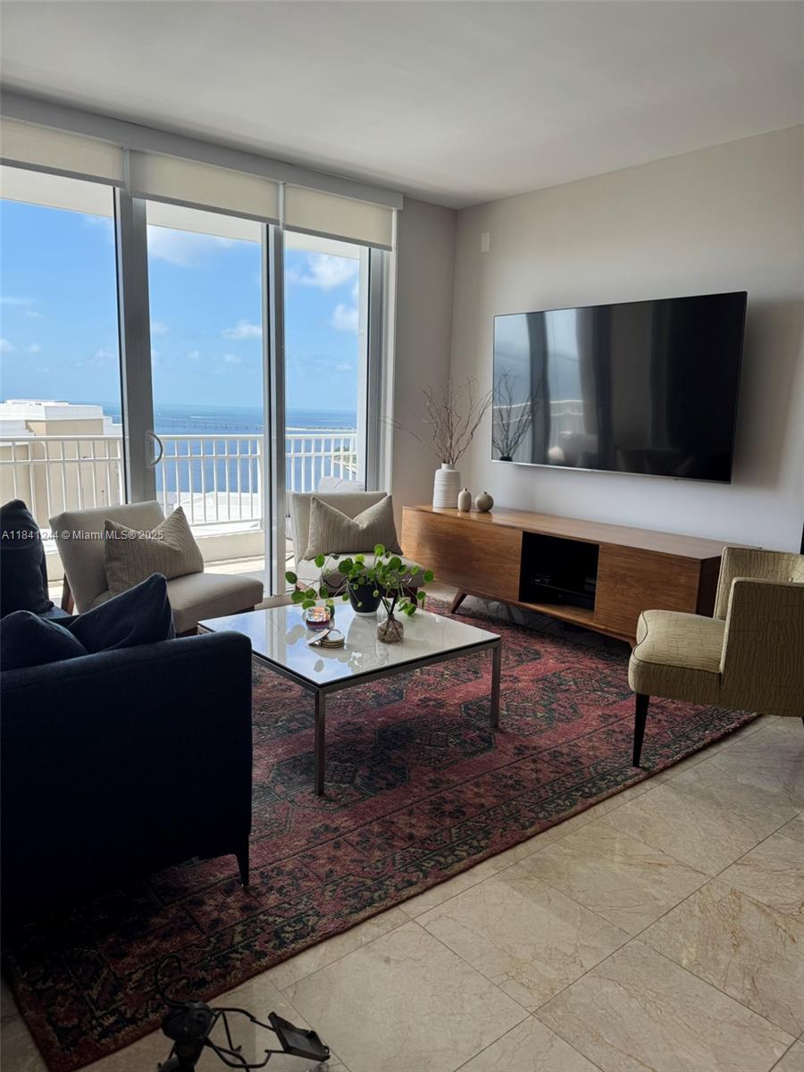 Experience luxury living in Unit 2705 at 801 Brickell Key Blvd, a high-floor 1-bed, 1.5-bath condo with stunning bay and city views. This refined residence features marble floors, an open kitchen with granite counters and stainless-steel appliances, and a spacious balcony. Enjoy the convenience of one assigned parking space and a deeded storage unit. Located in the Courts at Brickell Key, the building offers resort-style amenities including a heated pool, fitness center, concierge, and 24-hour security. Just steps from Brickell’s vibrant restaurants and shops, this unit blends island serenity with urban sophistication.