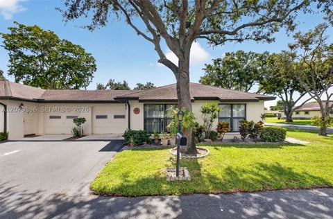 Photo of 10086 Eaglewood Rd #B, Boynton Beach, FL 33436 (MLS # A12079896)
