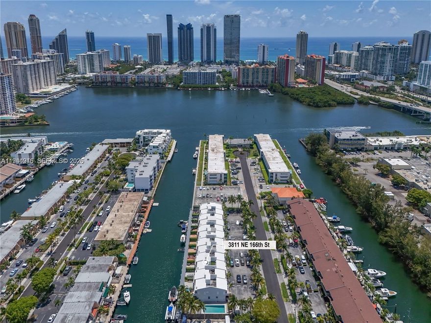 Discover unparalleled value with this premier condo in North Miami Beach! This exceptional property includes a coveted 30' deeded dock space with direct access to the Intracoastal Waterway—no fixed bridges and just 5 minutes to the Sandbar. This enchanting 3-bedroom, 2.5-bathroom residence blends modern elegance with coastal serenity. Step into an open-concept living area with gleaming porcelain tile, soaring ceilings, and abundant natural light. The Italian-style kitchen showcases sleek quartz countertops, high-end cabinetry, and a layout ideal for cooking, hosting, and gathering. The expansive primary suite is a true retreat, featuring rich hardwood floors, generous closet space, and a spa-like marble bathroom. Additional bedrooms are bright and well-sized, perfect for guests or a home office. Enjoy resort-style living with 24/7 gated security, 4 parking spaces, and a sparkling pool. This property is vacant, easy to show, and ready for you to move in. Secure your slice of paradise and live your dream life on the water today.