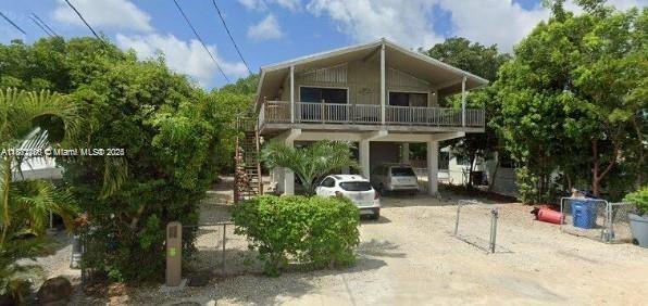 Ready for your own slice of paradise? This home offers everything and more for you to enjoy life in the Florida Keys! Main house has 2 bedroom and 2 bath. Private guest efficiency with its very own kitchen and bathroom downstairs. This home offers the perfect layout for families that with to entertain or simply want a relaxing getaway. The neighborhood is peaceful and calming; Once you move in , you won't want to move out! Rent the upstairs and efficiency $3750. Upstairs 2/2 only $3000. Efficiency only $1650. Landlords will consider 6 month lease if paid 6 month in advance. Pet rent $75 per month.