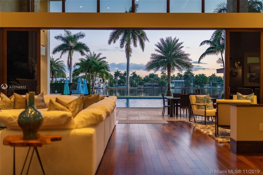 Tropical Modern Estate situated between Miami & Ft Laud, totaling approx 8k sq. ft., 6 bedrms/6.5 unique baths w/wide water views in every room & resort-style pool w/25k lot.  No fixed bridges, large dock w/20k lbs boat lift & 160' on water.  Summer kitchen, large hot tub, tanning shelf, & fire pit, full bar, gourmet kitchen; spa master bath,2 water closets & multi-person shower.  Bedrooms have full en-suite baths & 6th bedrm is attached via covered walkway & gym/office/in-law suite.  Windows & sliders are hurricane-impact & UV protected, the walls are concrete block construction & 2nd story has concrete floor. 5 AC zones, fireplace in living rm & master bdrm & Crestron lighting systm. 3 car garage,ample guest parking in governor’s drivewy. Visit Juana Drago YouTube for Video Tour.
