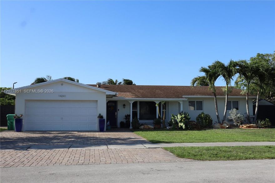 Tastefully remodeled 4-bedroom, 2-bathroom home featuring beautiful flooring throughout, updated bathrooms, a modern kitchen with granite countertops, and numerous upgrades throughout. Enjoy natural gas service with a gas range and dryer, an updated plumbing system, a privately owned water softener, and an epoxy-coated garage floor. The spacious backyard offers beautiful lake views and the perfect setting for relaxing or entertaining. Move-in ready and meticulously maintained.