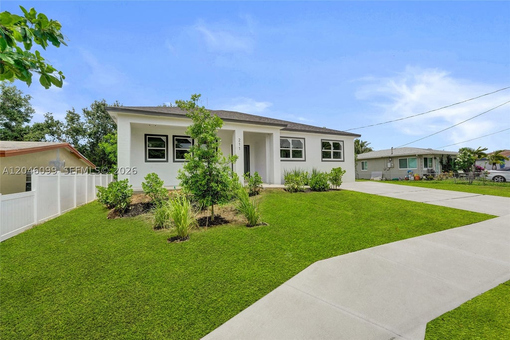 Photo of 211 NW 14th Ct, Dania Beach, FL 33004 (MLS # A12046099)