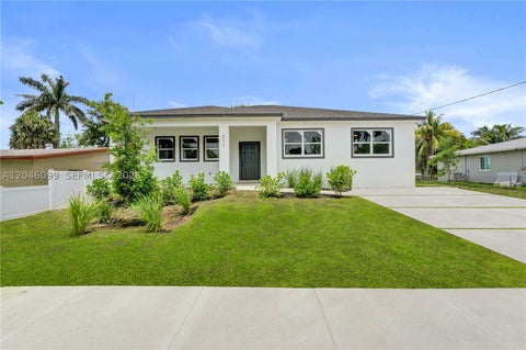 Photo of 211 NW 14th Ct, Dania Beach, FL 33004 (MLS # A12046099)