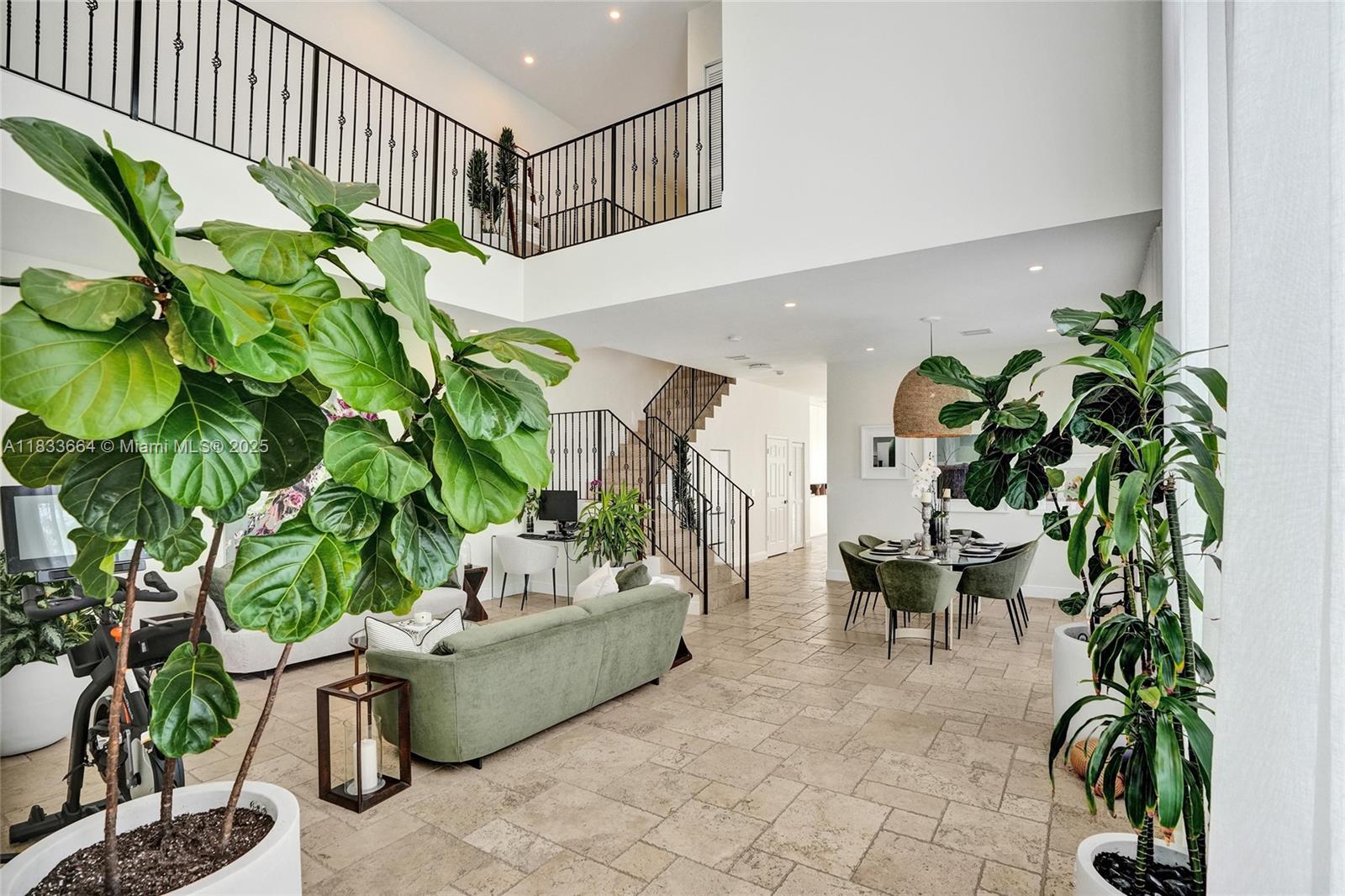 Elegant 3-bed, 2.5-bath townhome in a quiet Coral Way cul-de-sac, minutes from Coral Gables and Coconut Grove. This 2,830 sq ft home features soaring 20-ft ceilings, travertine marble floors, impact windows, and an open living space filled with natural light. The chef’s kitchen includes premium appliances, custom cabinetry, and ample storage.
The spacious primary suite offers a remodeled spa-style bathroom with rainfall shower and TOTO toilet. Enjoy a private backyard oasis with pool. Includes 1-car garage, extra parking, and walkability to the Shops at Merrick Park, train station, and top local fitness studios. Prime access to shopping, dining, and top schools.
