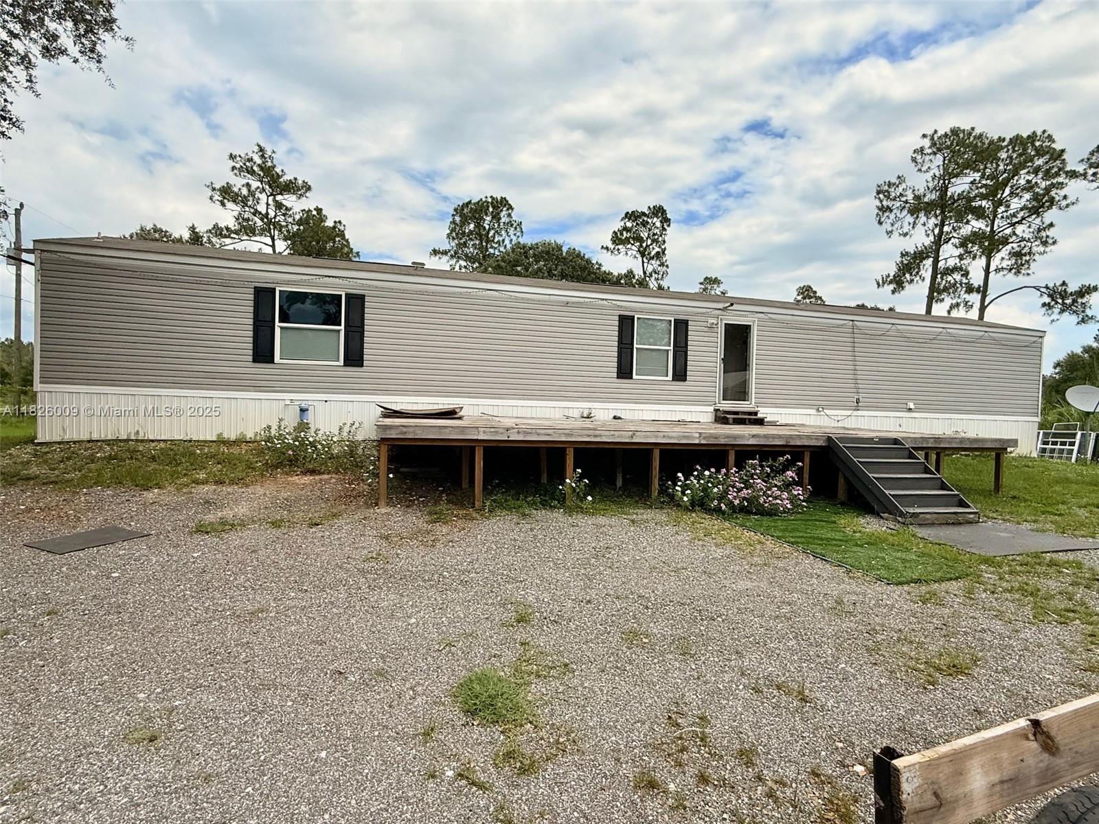Welcome to your slice of paradise in Montura Ranch! This charming 2023 Mobile Home with 3-bedroom, 2-bath, 1.25-acre lot—fully fenced and ready to enjoy. Whether you're seeking peaceful country living or the perfect weekend escape, this well-located gem offers endless possibilities. AC installed in 2023. Come explore the land, unwind under the open skies, and imagine all the memories waiting to be made. Easy to show. Measurements and information pertaining to listing are approximate and deemed accurate but not warranted by Seller nor listing agent/brokers.