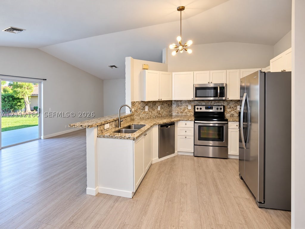 Photo of 1867 Andromeda Ln, Weston, FL 33327 (MLS # A12112160)