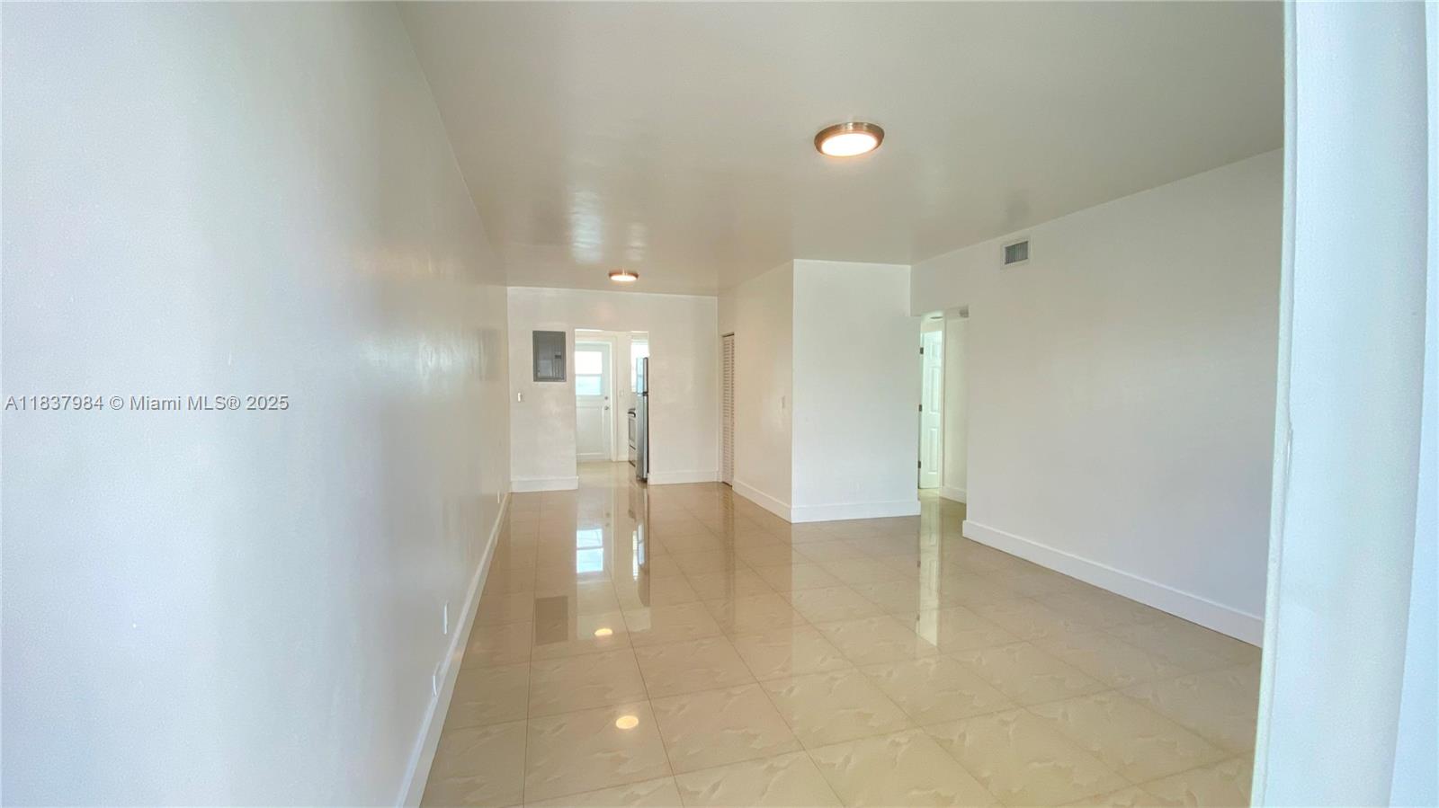 AVAILABLE Immediately, beautifully updated 2/2 apartment on ground floor, painted ALL WHITE, tile floor throughout, S/S Kitchen w/ Quartz countertop. Washer & Dryer IN THE UNIT, central A/C, Impact windows/doors, street parking only. Apartment is available first week of March, fast approval. Owner requires 1 first month and 2 months deposit. Well-kept property Video, AVAILABLE immediately.