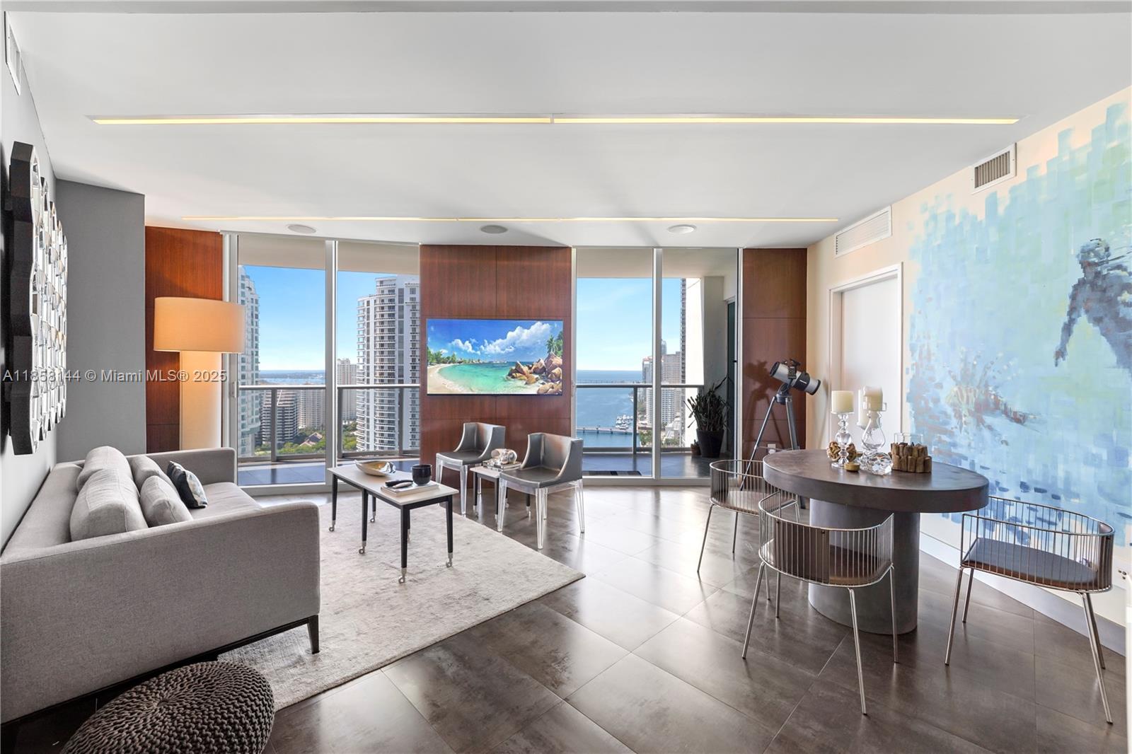 Bring your most discerning tenant! Amazing views! Fully furnished unit in impeccable condition, perfect for Corporate rental; electric shades, kitchen and bathrooms totally upgraded, elegant tile floors throughout, automated sound control, this unit is TOP OF THE LINE! Best line in the building, huge balcony facing East. One assigned parking space. Gym is getting brand new LifeFitness equipment Water, basic cable and Internet included. Walk to Whole Foods, Bayfront Park, metro mover, Novikov Restaurant, Joe & the Juice downstairs plus 17 screens' Silverspot Cinema and Gordon Ramsay's Hell's Kitchen. Steps to sports, art venues, restaurants & shops. Building offers luxurious life style, 24-hr front desk attended. Chic downtown living at its best! Pool is currently closed for repairs.