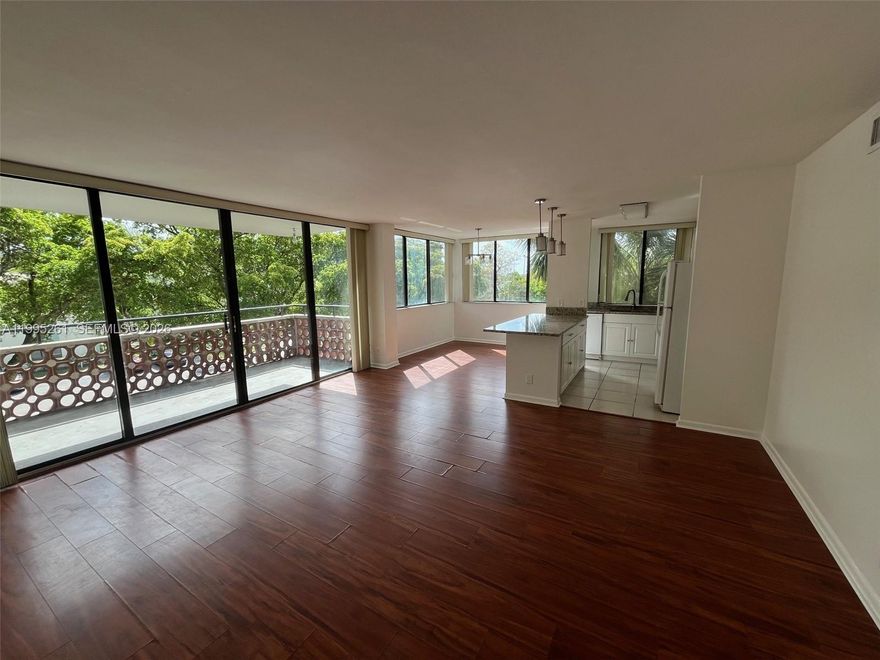 Move right into this spacious, updated 2-bedroom, 2-bathroom apartment. Located in a peaceful, family-friendly area, it features a large master bedroom with a beautiful shower and walk-in closet. The open layout includes a modern kitchen and dining area. Wood floors throughout, tiled bathrooms, windows in every room and a large balcony. Well maintained property lobby and grounds. Minutes from local shops and restaurants.