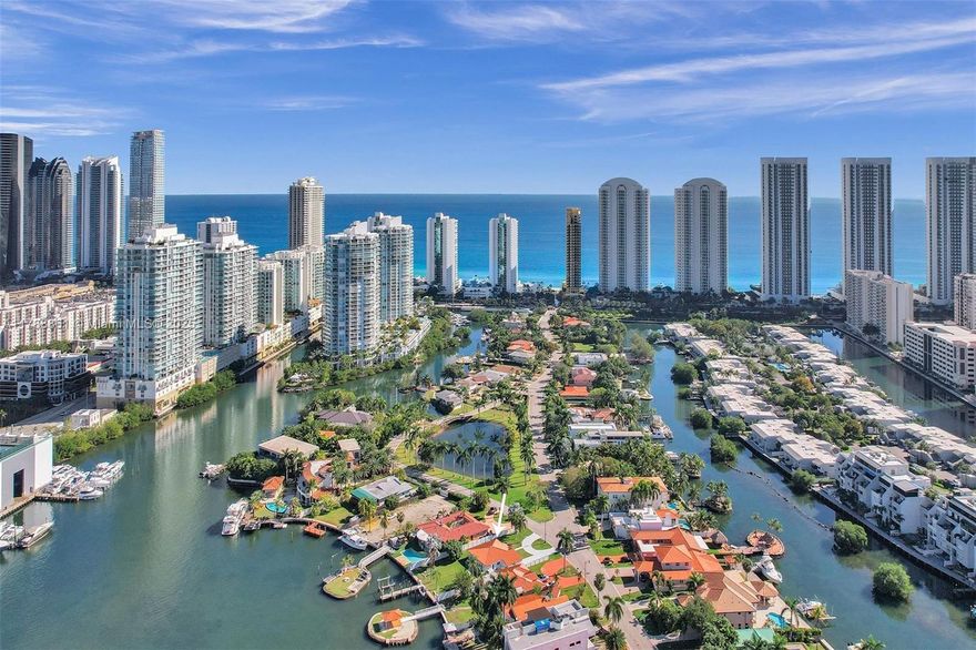 Waterfront living in the desired Atlantic Island in Sunny Isles, located on the Intracoastal Waterway with private dock, and deeded beach access across the street for Island residents. Atlantic Isle is a secluded island across the street from the beach with easy access to shopping, airport, Houses of Worship, Bal Harbour Shops and Aventura Mall. You have the best of both worlds, private dock space with a lift and deeded beach access. No fixed bridges to the Bay or Ocean. Fall in love with the beautiful Sunsets from your own backyard, enjoy the ocean breeze and endless water views from every room. New kitchen cabinets, new appliances, impact windows and doors, plenty of parking and a very spacious backyard overlooking the intracoastal waterway. Do not disturb tenant