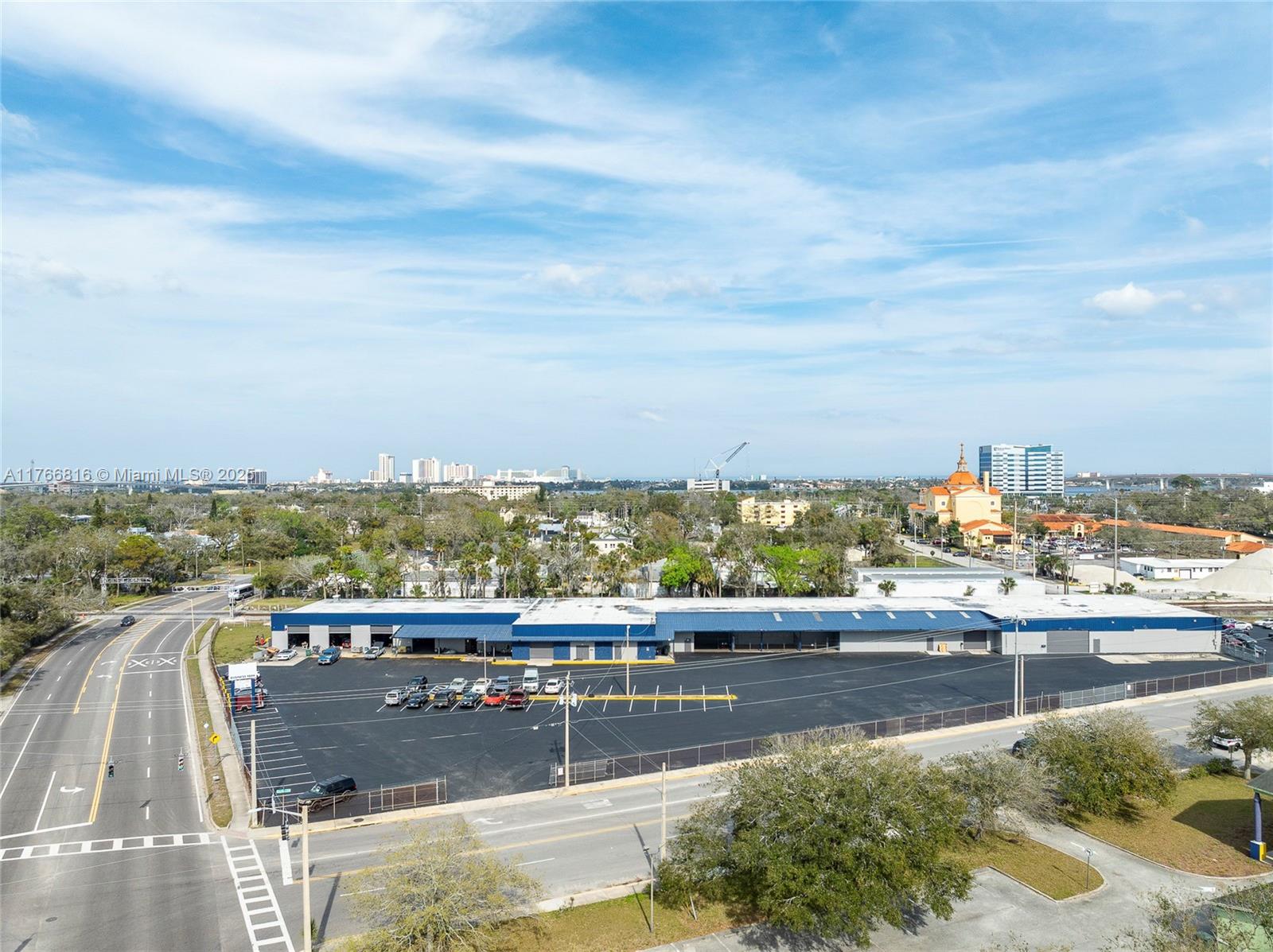 We're proud to present 405 N Charles Street, this versatile Multi-Bay Warehouse sits in a
prime location of Daytona Beach, with direct frontage on George W Engram Blvd/Fairview Ave, which leads
right to the Boardwalk Main Street Pier on the beach. This property features one warehouse building built
in 1970, five separate units, nine loading doors, 16-foot clear heights with roughly 10% of each unit as
office space. The building size is 37,399 square feet on a large, oversized lot of 3.45 acres or 150,265
square feet. There are currently two tenants occupying about 16,600 SF (45% of building) whose leases
end in June 2025.