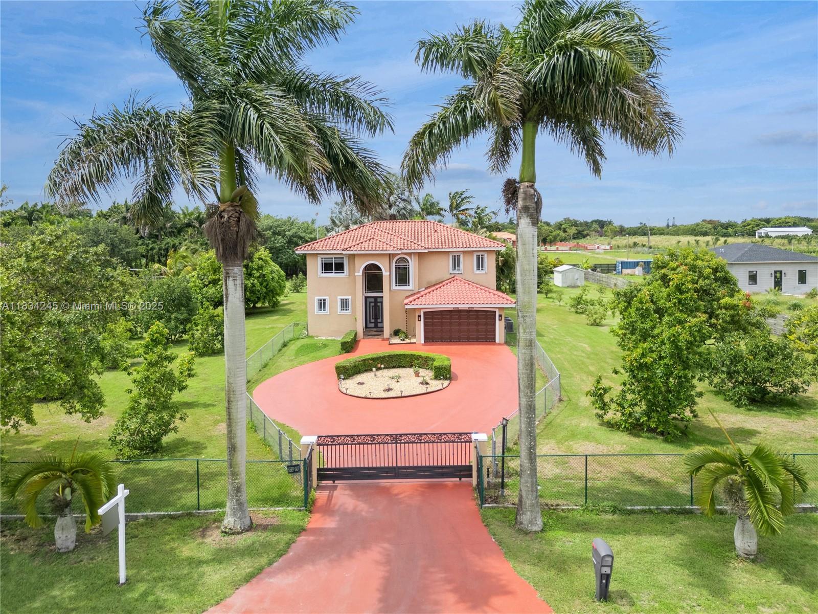 Beautiful Mediterranean Estate! Featuring a 2 story, 5 Bedroom, 3.5 Bath on a 54,885 Sq Ft Lot.Entering the arched doorway, you encounter the high ceilings, spacious living & dining area. Second floor has plenty of closets, laundry, 3 bedrooms & the Principle Suite. The Main Suite has a surround sound system, walk in closet & a very large ensuite. Downstairs is the kitchen with a large peninsula leading to the family with open view of the pool. The pool area is perfect for entertaining with it's spacious courtyard, a cozy pergola & a perfect view of the tennis court. The outside oasis awaits you with majestic trees throughout including avocado, mango, lime, key lime, lechi, nispero, palm, ceiba, grapefruit, & limoncello from rome. Come make this your forever farm home.