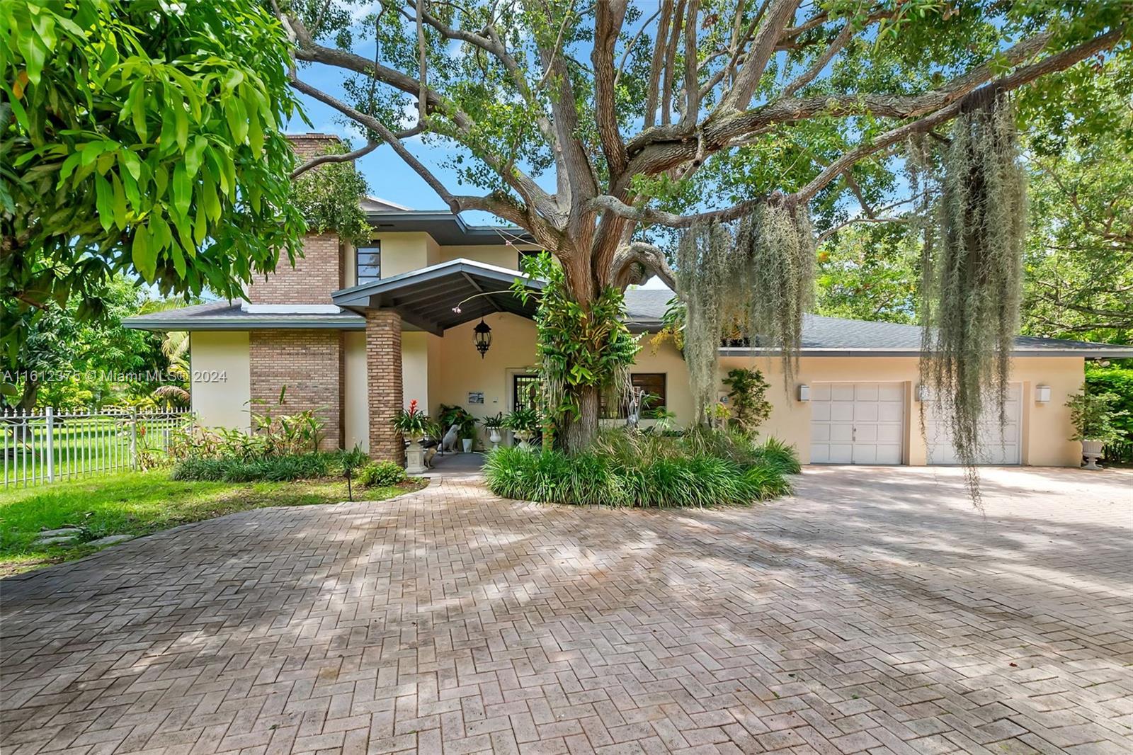 Truly spectacular and unique 1.3 acre sprawling gated property in North Palmetto Bay. Complete with ancient majestic oaks, covered in orchids and flourishing staghorn ferns, this is truly a one-of-a-kind opportunity. Spacious existing 2 story home is full of charm and potential, update to your own taste. 3 fireplaces, grand living spaces includes open concept kitchen, family room and dining with gorgeous open farmhouse style vaulted ceiling. Private pool surrounded by lush tropical foliage. Large pavered driveway & car park , 2 car garage. Subdivide the lot and build a fabulous new construction estate or just enjoy your own tropical paradise.