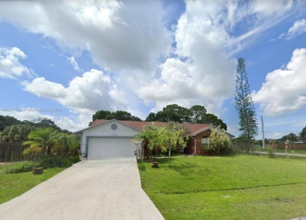 Photo of 1198 SW Ingrassina Ave, Port Saint Lucie, FL 34953 (MLS # A11460919)