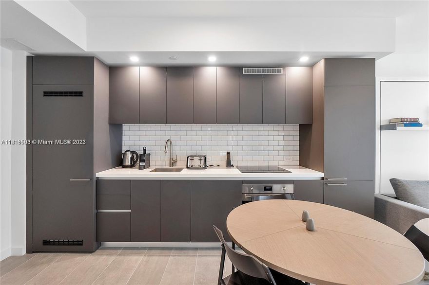 Gorgeous Studio at Brand New Yotelpad Miami, Skyline view of the city. Very nicely furnished, the apartment features ceramic floor all over, full kitchen with stainless steel appliances, washer and dryer, glass shower, Circe Board Horizontal opening queen-size wall bed with desk and Tango Sofa transforming queen-size wall bed with sofa easily sleeps 4, this unit is equipped with everything you need. New construction building with spectacular amenities, community heated pool, gym, poolside bar, co-working space. Walking distance from FTX Arena, Bayfront Park and Bayside for shopping.  6 months min lease. Option to sublease can be considered just for 1 year lease, not less.