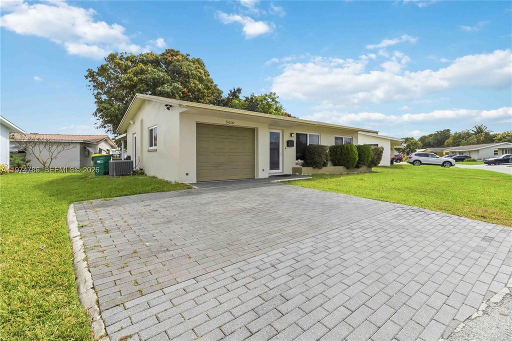 Photo of 5616 NW 48th Way, Tamarac, FL 33319 (MLS # A11974786)