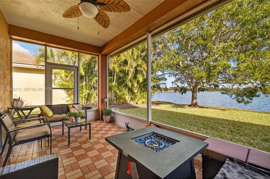 Least expensive waterfront property in the community! This beautifully maintained 3BR/2BA lakefront home in the gated Heritage Oaks community of Tradition. This single-story residence features tile flooring throughout, an open layout, and a spacious kitchen with stainless-steel appliances, breakfast bar, and tile roof. The primary suite offers a walk-in closet, walk-in shower, and vanity makeup station. Enjoy peaceful lake views from the covered and screened-in patio and relax in the tranquil backyard setting. Heritage Oaks residents enjoy resort-style amenities including a clubhouse, fitness center, pool, and hot tub. Cable, internet, security, lawn maintenance, pest control included with HOA fees. Prime location near Tradition Square's shopping, dining, and easy I-95 access. Move-in ready and ideal for enjoying the best of Florida living.