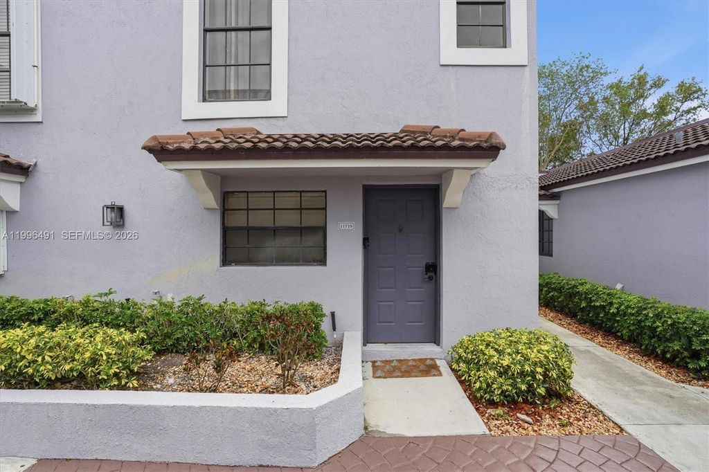 Photo of 11719 NW 11th St, Pembroke Pines, FL 33026 (MLS # A11996491)