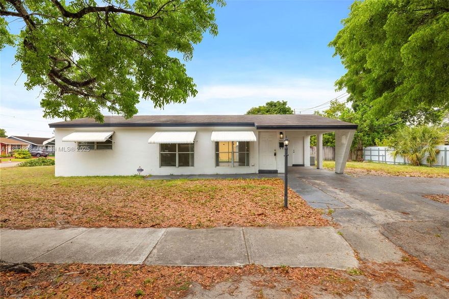 Exceptional Corner Lot Opportunity in Hollywood! This charming 3-bedroom, 2-bathroom single-family home sits on a spacious 7,528 sq ft corner lot—offering exceptional privacy and space for expansion or a pool. The 1,250 sq ft interior features a practical layout with ceramic floors, and new wood floors in the bedrooms, remodeled bathrooms, new roof in 2018, first-floor entry, and a utility/laundry room. Key Highlights: • Corner Lot: Extra space for outdoor living, parking, or customization. • Solid Build: Concrete block with central A/C, covered driveway, and patio. • Great Value: with new kitchen cabinets, bedroom floors, new bathrooms, new roof in 2018 • No HOA—ideal for first time owner • Sold "As-Is" with comps supporting strong value. showings via showing time.