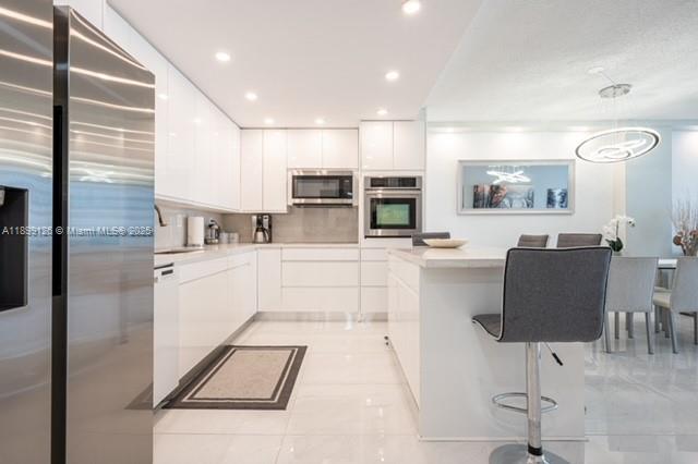 View photos, virtual tours, details... 19370 Collins Ave 608
