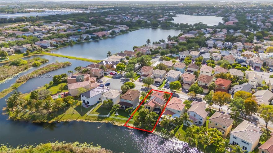 The lakefront home you’ve been waiting for in the guard-gated community of Silver Shores, one of West Miramar’s most sought-after neighborhoods. Offering over 2,400 square feet, this 4-bedroom, 2.5-bath residence features soaring two-story vaulted ceilings and an open, light-filled layout designed for both everyday living and entertaining. Major upgrades include a NEW ROOF (2022), NEW AC, Full Hurricane protection with IMPACT WINDOWS AND DOORS, and solar panels, delivering long-term energy efficiency and savings. And a  FULL HOUSE WATER FILTRATION SYSTEM. The kitchen offers granite countertops, stainless steel appliances, and a functional layout that flows seamlessly into the main living areas. Upstairs, a spacious primary suite includes two closets, a walk-in closet, dual sinks, and a Roman tub with a separate shower. Step outside to a private lakefront backyard with a screened-in patio, fruit trees, and no rear neighbors, creating a peaceful outdoor retreat with room for a pool. Additional features include a separate laundry room and two-car garage. Residents enjoy resort-style amenities including a clubhouse, pool, fitness center, tennis courts, and playgrounds. Ideally located near Miramar Regional Park, shopping, dining, hospitals, and I-75. Zoned for A-rated schools. The paint color has been virtually enhanced.